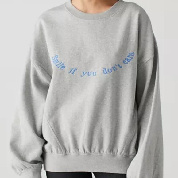 Urban Outfitters Tops - Urban Outfitters embroidered "smile if you don’t care" crewneck sweatshirt